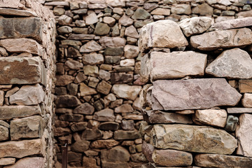 Macro close-up focused on foreground of stones in Pucara de Tilcara in Jujuy, Argentina