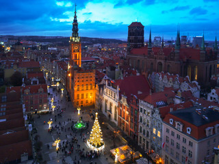 Aerial view of the old town in Gdansk with beautiful christmas tree at dusk, Poland