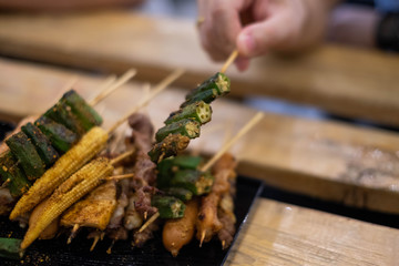Grilled with Chinese Sichuan Peppers (Ma-la) style, Seller prepare for meals, balls, seafoods and vegetables grill with Sichuan pepper. (Thai Street food.)