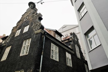 Riga, Latvia, November 2019. The black house stands out among the buildings of the quarter.