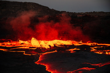 Waves of lava at the surface of Erta Ale lava lake - obrazy, fototapety, plakaty