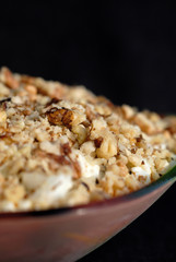 Salad seasoned with mayonnaise and sprinkled with chopped nuts. Shallow depth of fields