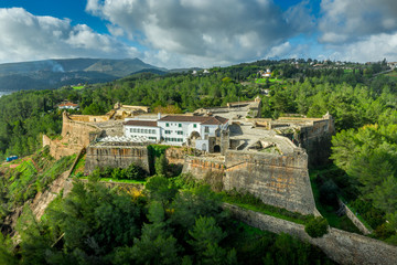 Aerial view of fortress Sao Felipe in Setubal Portugal, star shaped military base protecting the city and the harbor with bastions