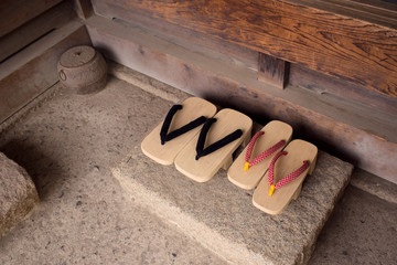 Male and female traditional sandals at old Japanese home entrance　下駄 カップル 男女...