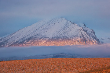 Fototapeta premium Peaks of High Tatras at dawn, beautiful outdoor winter background