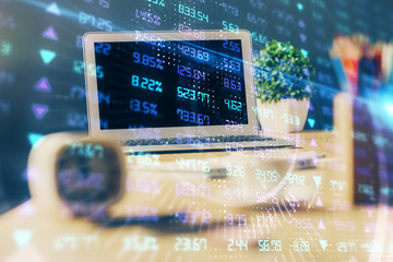 Financial chart drawing and table with computer on background. Double exposure. Concept of international markets.