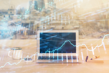 Forex market graph hologram and personal computer on background. Double exposure. Concept of investment.