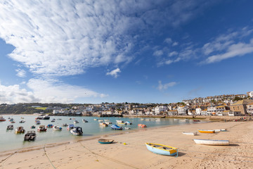 Fototapeta na wymiar Wide view of Boats Moored at St Ives Harbour in Cornwall, England, UK.