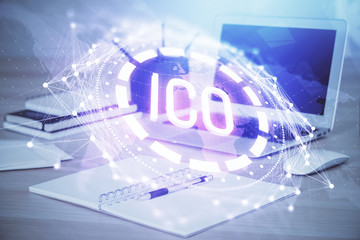 Multi exposure of blockchain theme hologram and table with computer background. Concept of bitcoin crypto currency.