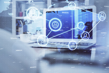 Naklejka premium Computer on desktop with social network theme icon. Multi exposure. Concept of international connections.