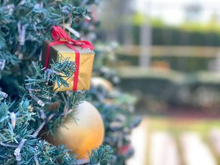 Christmas background,gift,ball and bell in pine tree with blurred background.