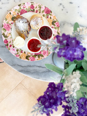 scones with jam and cream,tea break time with dessert on marble table
