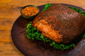 Roasted Turkey Breast Cajun Style Deli Lunch Meat on Old Wooden Background. Selective focus.