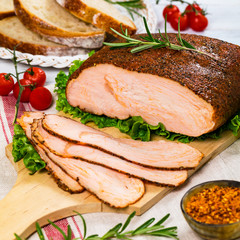 Cajun Style Roasted Turkey Breast Deli Sliced Lunch Meat on White Wooden Background. Selective focus.