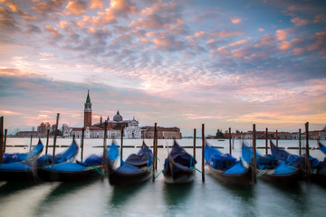 Gondolas at St Mark square at sunrise