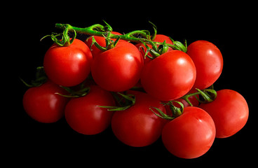 red cherry tomatoes on a black background