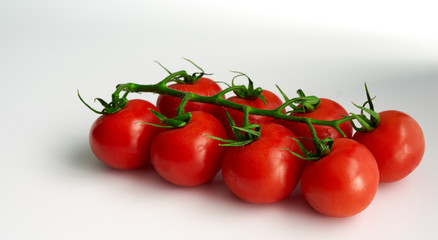 red cherry tomatoes on a white background