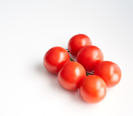 red cherry tomatoes on a white background