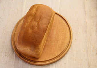 Composition with bread on cutting board, closeup. And space for text