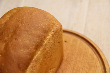 Composition with bread on cutting board, closeup. And space for text