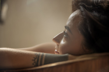 Close up of attractive lady enjoying beauty bath at spa