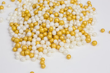 heap of sugar sprinkles in white and yellow