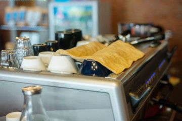 Hot coffee mug on an espresso maker