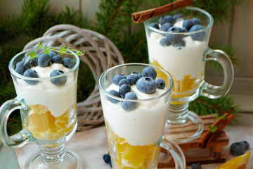 blueberry orange smoothie with cream mousse in a glass jar, pubs