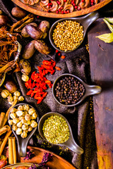 Top view Thai spices and herbs ingredient decoration on wood table for cook in home kitchen. 