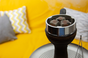 Recreation and entertainment. Hookah, coals and smoke in a relaxing environment