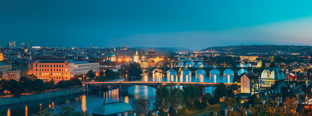 Prague, Czech Republic. Evening Panoramic View Of Evening Cityscape In Night Lighting. Charles Bridge, Manes Bridge, Straka Academy. Famous Landmarks, UNESCO World Heritage - obrazy, fototapety, plakaty