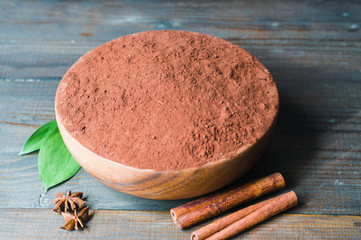 cacao powder in wooden bowl close up 