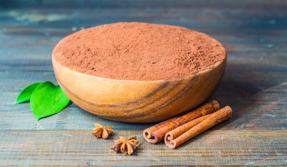 cacao powder in wooden bowl close up 
