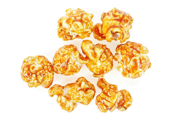 Close-up of delicious caramel popcorn isolated on white background. Top view.