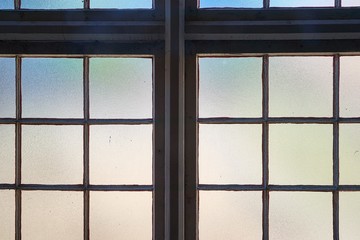 Window in a dim old building interior, industrial hall