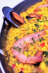 Pot with yellow rice and sea food