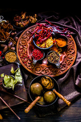 Top view Thai spices and herbs ingredient decoration on wood table for cook in home kitchen. 
