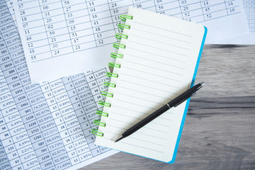 notepad with documents on desk