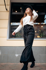 Young stylish woman in a city street