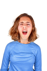 Teenager girl in a classic blue T-shirt screams in pain with her mouth open