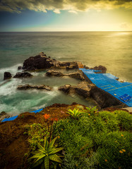 Sunset on coast of sea in Madeira