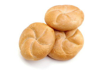 Freshly baked Kaiser rolls, isolated on white background