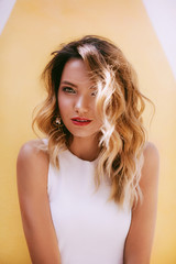 Portrait of beautiful young woman  with makeup in fashion white clothes