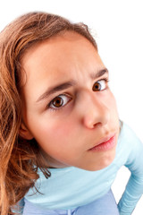 Cute teenager girl with funny face expression looking to camera, isolated. April fool day