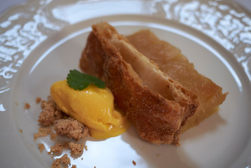 Apple cake with ice cream and amaretto