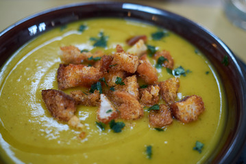 Pumpkin soup with croutons and parsley