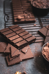 Chocolate bars and pieces on a dark background