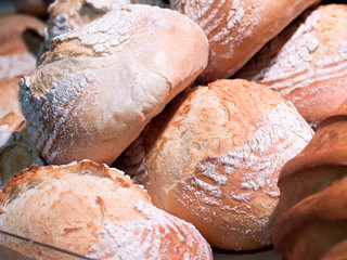 Stack of breads in parketplase. Fruits on store