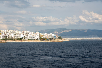 Fototapeta premium The city of Athens with white houses seen from the sea. Greek coast, Europe