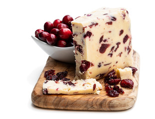 Cranberry cheddar cheese with wheat crackers isolated on white
